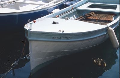 High angle view of fishing boats moored at harbor