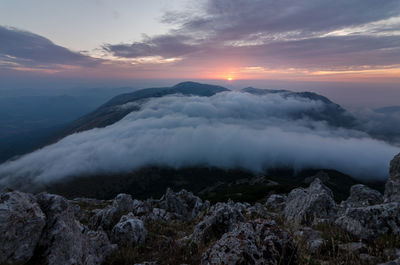 Scenic view of mountains against sky during sunset