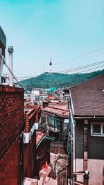 High angle view of buildings in city against clear sky