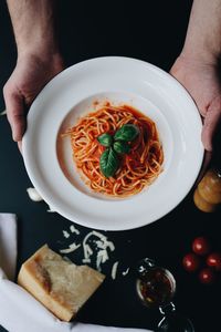 Midsection of man having food in plate