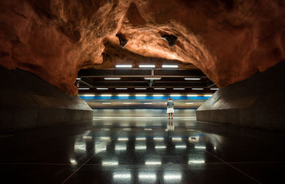 Interior of illuminated tunnel at subway station