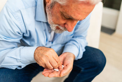 Midsection of man holding hands