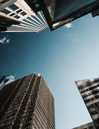 Low angle view of modern buildings against sky