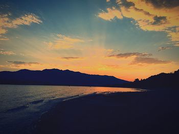 Scenic view of sea at sunset