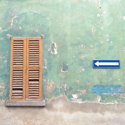 Close-up of wall with closed door