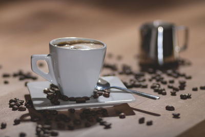 Close-up of coffee cup on table