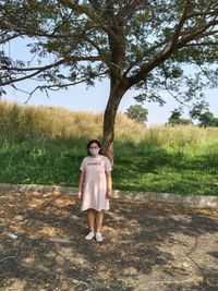 Full length of woman standing on field