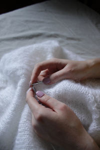 Woman knitting a sweater 