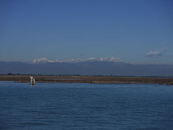 Scenic view of sea against blue sky