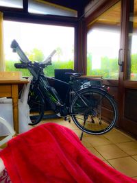 Bicycle parked by window