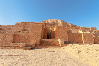 View of historical building against clear blue sky