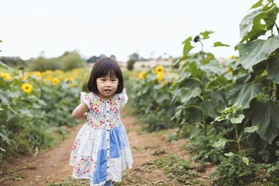 Cute girl standing on field