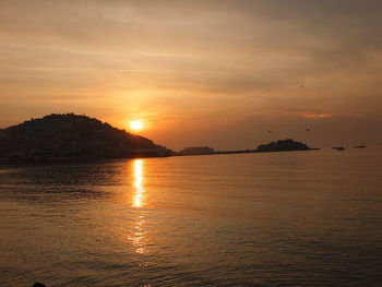 Scenic view of sea against sky during sunset