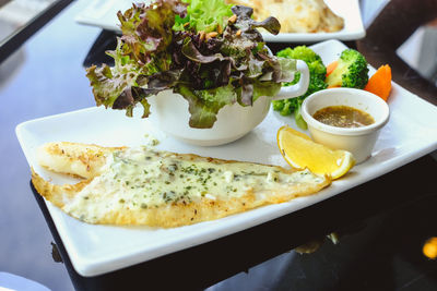 Close-up of served food in plate