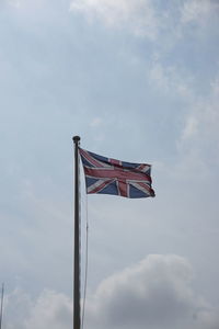 Low angle view of british flag against sky