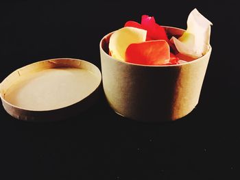 Close-up of fruits against black background