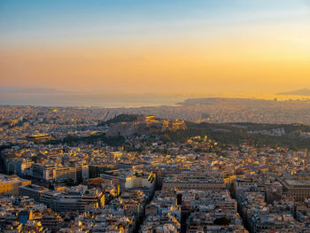 High angle view of city at sunset