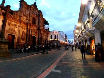 People in front of buildings