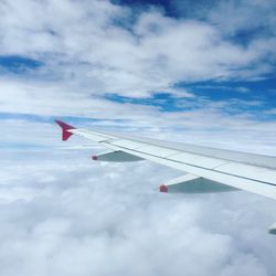 Low angle view of airplane flying in sky