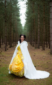 Portrait of a smiling young woman in forest