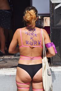 Rear view of women standing in front of woman