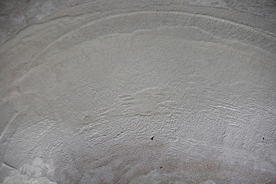 High angle view of footprints on sand