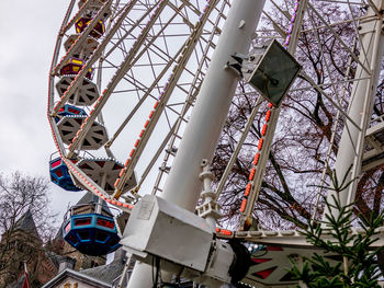 Low angle view of ferris wheel against sky