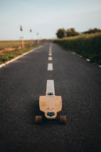 Close-up of skateboard on road