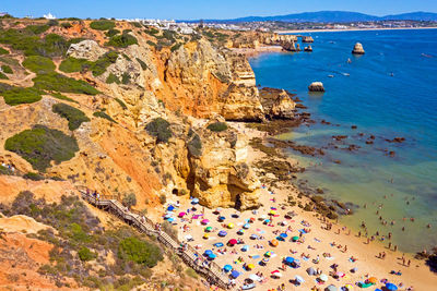 Aerial from praia do camillo on a rocky southcoast near lagos in portugal