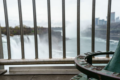 Close-up of railing against sky