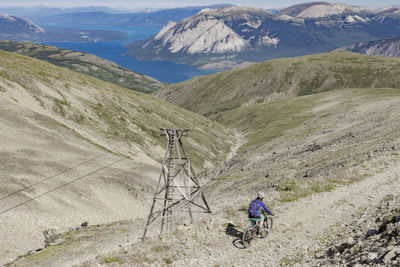 Man riding bicycle on mountain