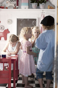 Children in playhouse