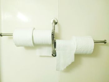 Close-up of toiler paper hanging in bathroom