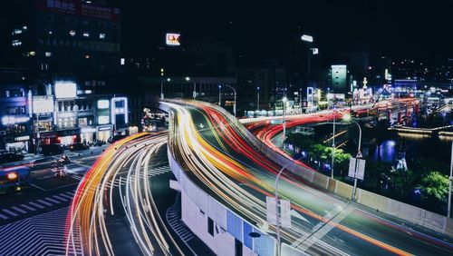 High angle view of light trails on city street at night