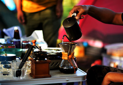 Cropped hand of man holding coffee