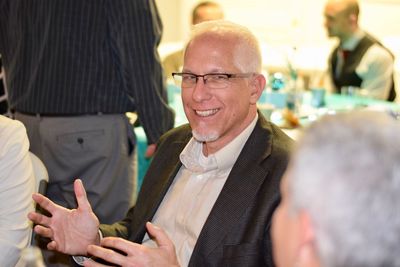 Smiling man talking with colleague