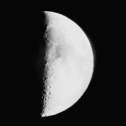 Low angle view of moon against sky at night