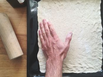 High angle view of man hand on table