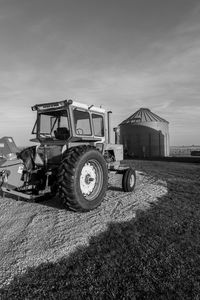 Tractor on field against sky