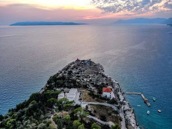 High angle view of sea against sky during sunset