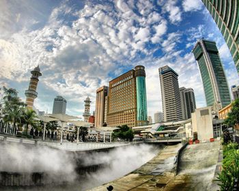 Modern buildings in city against sky