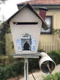 Close-up of birdhouse on building