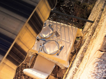 High angle view of sunshade and restaurant table