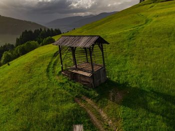 Gazebo on field against sky