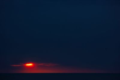 Scenic view of sea against sky at night