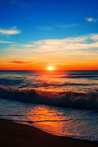 Scenic view of sea against sky during sunrise 