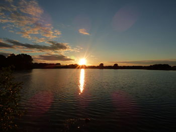 Scenic view of calm sea at sunset