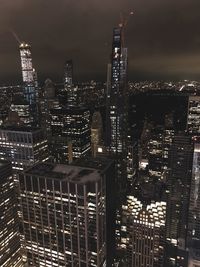 High angle view of illuminated buildings in city at night