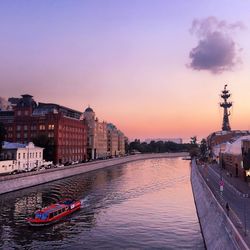 Bridge over river at sunset