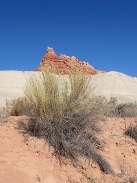 View of desert against blue sky